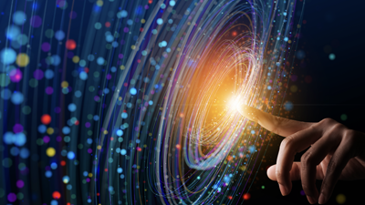 human finger pointing at the middle of an orbital of colorful dots