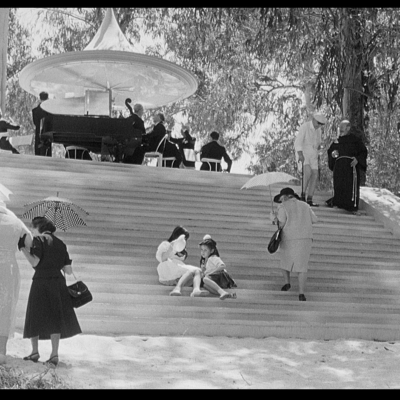 8.5 film image (people sitting on steps outside).