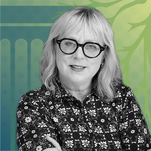 Karen Swallow Prior_blonde woman with shoulder-lenth blonde hair. she's wearing dark-rimmed glasses and a patterned blouse.