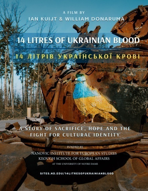 Heavily rusted, damaged tank with a bird painted blue and yellow, like the Ukrainian flag, on its side.